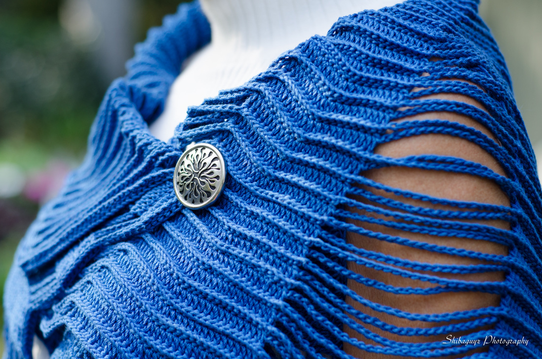 Flame pedestal button by Jul Designs featured on the Half Circle Cardigan in Crochet Geometry